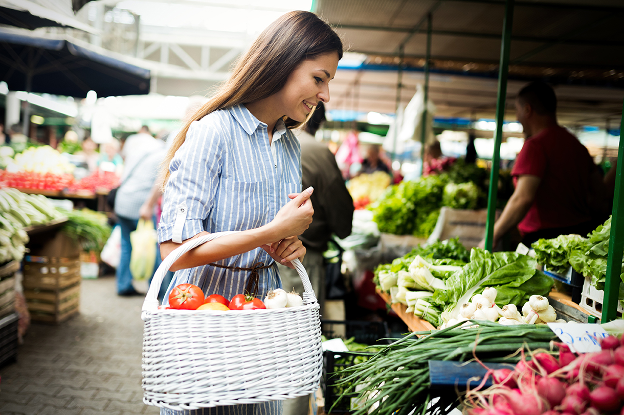 young-woman-buying-vegetables-at-the-market-2023-11-27-05-05-31-utc